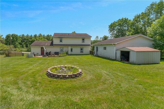 6414 Elk Rd, Canfield, OH 44406 - back of property featuring a garage and an outbuilding
