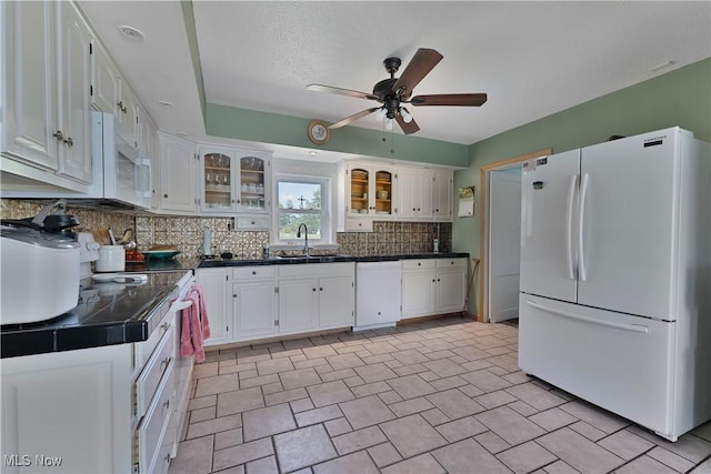6414 Elk Rd, Canfield, OH 44406 - kitchen with white appliances, dark countertops, white cabinetry, a ceiling fan, and tasteful backsplash