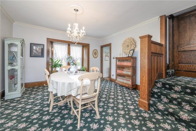 312 S Cleveland Ave, Mogadore, OH 44260 - carpeted dining area with crown molding and a chandelier