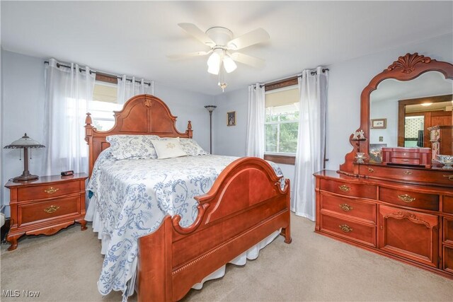 312 S Cleveland Ave, Mogadore, OH 44260 - bedroom featuring light colored carpet and ceiling fan