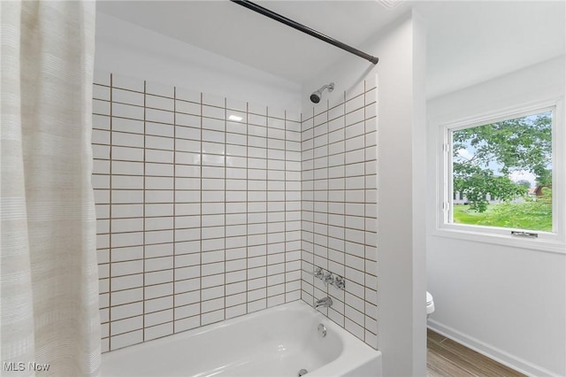 2413 W Manor Ave, Struthers, OH 44514 - bathroom with shower / bath combination with curtain and wood finished floors