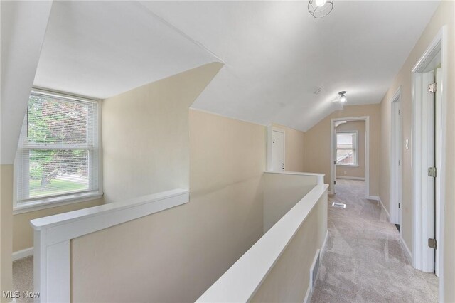 2413 W Manor Ave, Struthers, OH 44514 - corridor with an upstairs landing, light carpet, and vaulted ceiling