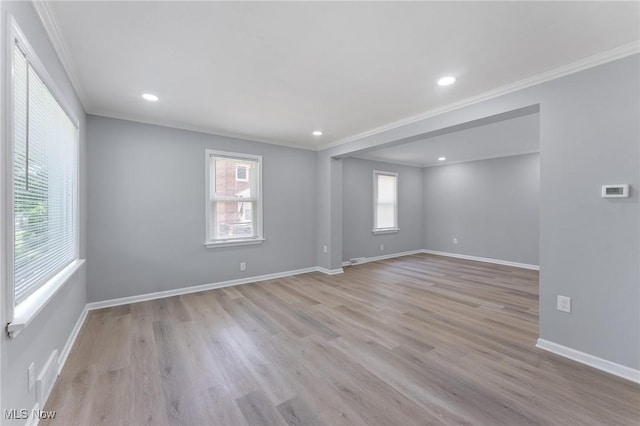 2413 W Manor Ave, Struthers, OH 44514 - empty room with ornamental molding, light wood-style floors, and recessed lighting