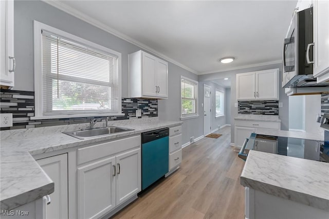2413 W Manor Ave, Struthers, OH 44514 - kitchen with dishwashing machine, ornamental molding, decorative backsplash, stainless steel microwave, and white cabinets