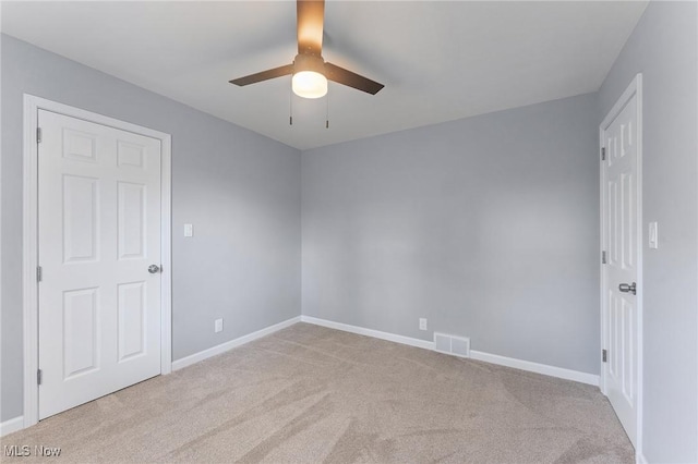 2413 W Manor Ave, Struthers, OH 44514 - carpeted empty room with a ceiling fan and baseboards
