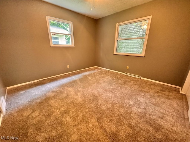 1587 Hilda St, Lakemore, OH 44250 - unfurnished room featuring carpet flooring and a textured ceiling