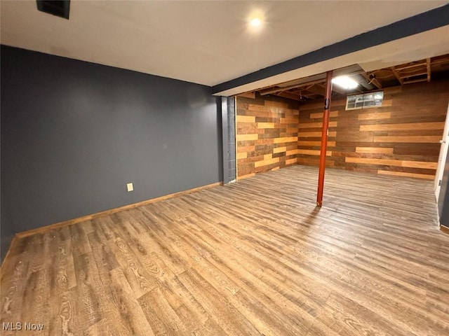1587 Hilda St, Lakemore, OH 44250 - finished below grade area with wood finished floors and wooden walls