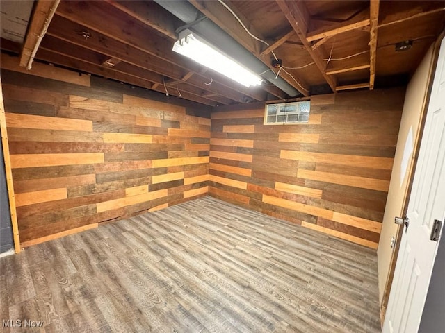 1587 Hilda St, Lakemore, OH 44250 - unfinished basement with wooden walls and wood finished floors
