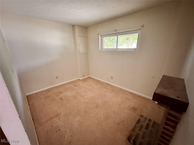 1587 Hilda St, Lakemore, OH 44250 - carpeted spare room with baseboards