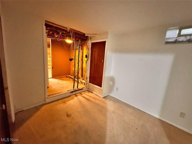 1587 Hilda St, Lakemore, OH 44250 - below grade area featuring baseboards and carpet