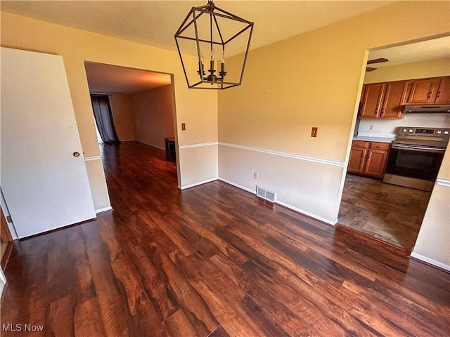 931 Pearson Cir Unit 3, Boardman, OH 44512 - unfurnished dining area featuring dark wood finished floors and a chandelier
