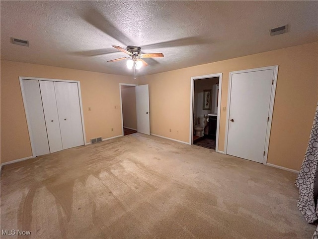 931 Pearson Cir Unit 3, Boardman, OH 44512 - unfurnished bedroom with carpet, a textured ceiling, ensuite bathroom, and a ceiling fan