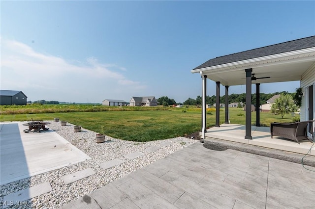 3508 Boos Rd, Huron, OH 44839 - view of patio with a ceiling fan and an outdoor fire pit