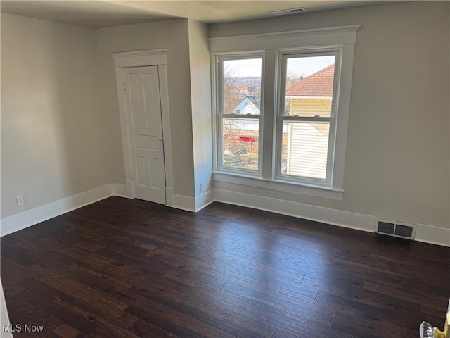 703 Locust St, Coshocton, OH 43812 - empty room featuring dark wood-style floors