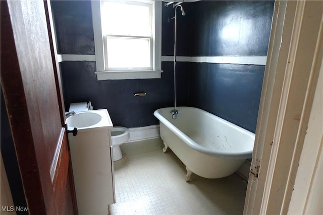 2171 15th St SW, Kenmore, OH 44314 - bathroom featuring a freestanding tub, vanity, and tile patterned flooring
