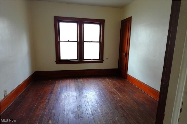 2171 15th St SW, Kenmore, OH 44314 - unfurnished room with dark wood-type flooring and baseboards