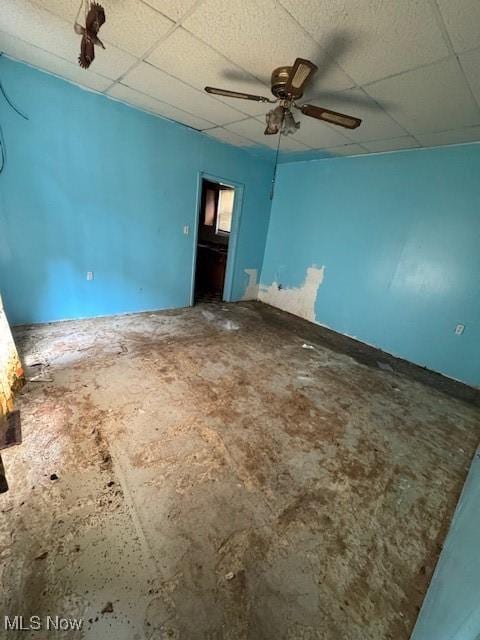 3454 Fulton Rd, Cleveland, OH 44109 - empty room featuring a drop ceiling and ceiling fan