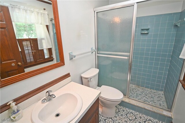 5735 Herbert Rd, Canfield, OH 44406 - full bath with vanity, a shower stall, and tile patterned floors