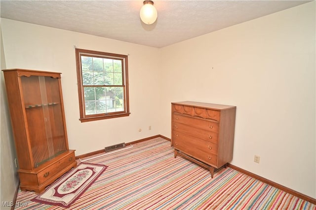 5735 Herbert Rd, Canfield, OH 44406 - bedroom featuring light colored carpet and a textured ceiling