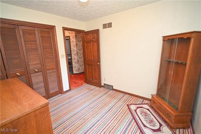 5735 Herbert Rd, Canfield, OH 44406 - unfurnished bedroom featuring carpet flooring, a closet, and a textured ceiling