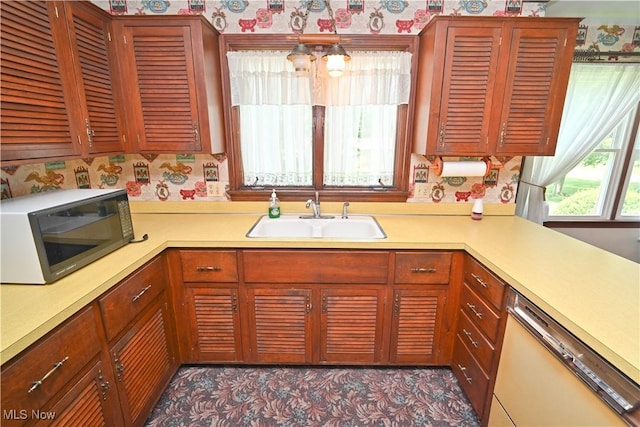 5735 Herbert Rd, Canfield, OH 44406 - kitchen featuring white dishwasher, black microwave, wallpapered walls, and light countertops