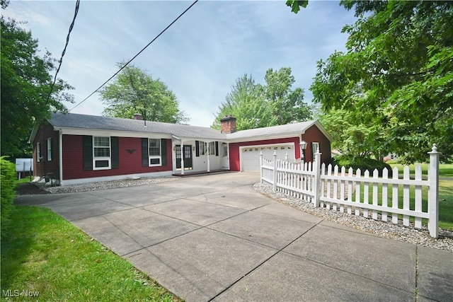 5735 Herbert Rd, Canfield, OH 44406 - ranch-style home with driveway, a garage, and a chimney