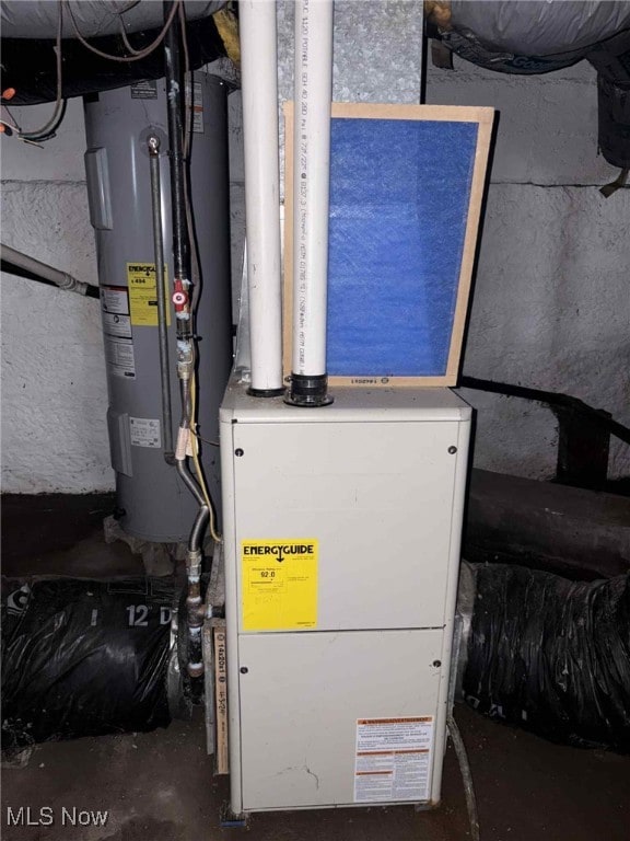 1624 Orchard St, Coshocton, OH 43812 - utility room featuring electric water heater and heating unit