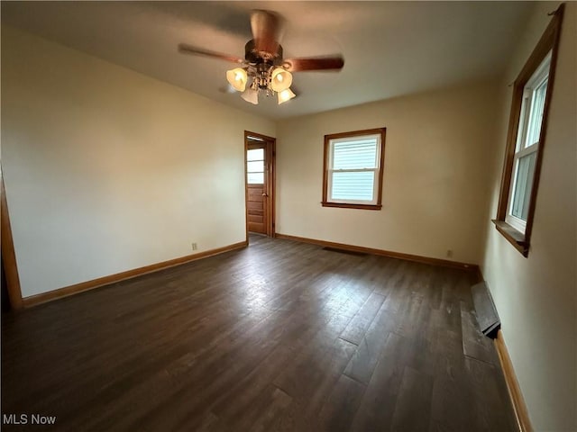 218 Vine St, Coshocton, OH 43812 - empty room featuring dark wood-type flooring and a ceiling fan
