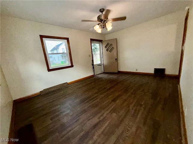 218 Vine St, Coshocton, OH 43812 - spare room featuring wood finished floors and a ceiling fan