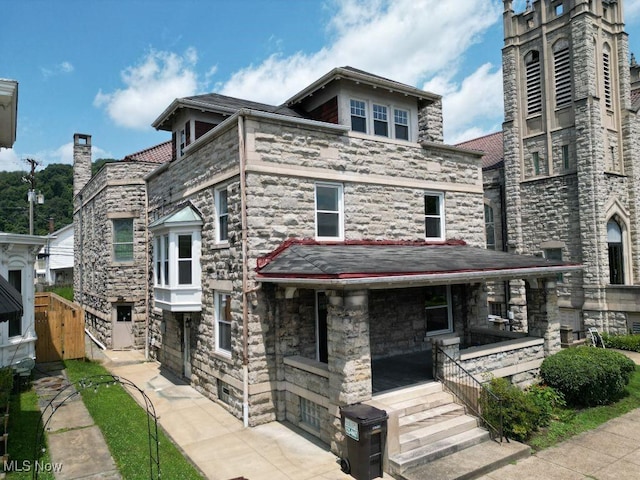 525 Riverside Ave, Wellsville, OH 43968 - view of front facade with covered porch and stone siding