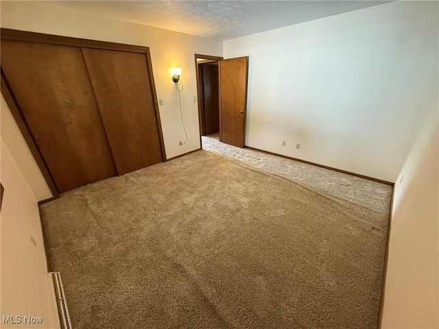 122 N Fairview Ave, Dover, OH 44622 - unfurnished bedroom featuring carpet floors and a closet