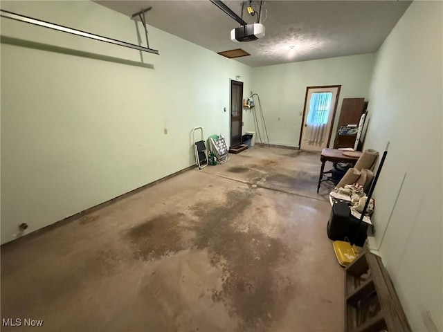 122 N Fairview Ave, Dover, OH 44622 - garage with a garage door opener and baseboards