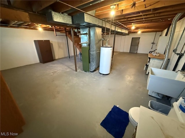 122 N Fairview Ave, Dover, OH 44622 - unfinished below grade area featuring gas water heater and heating unit