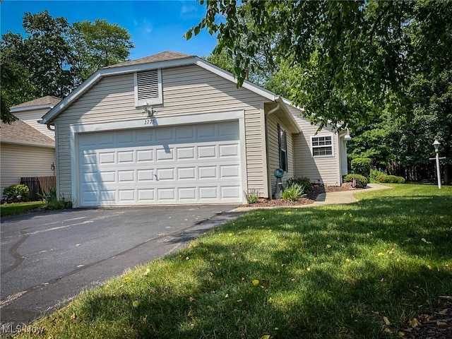 3775 Woodbury Oval, Stow, OH 44224 - view of front facade featuring a garage and a front lawn