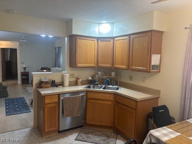 209 Potters Cir, Girard, OH 44420 - kitchen featuring dishwasher, brown cabinetry, light countertops, ceiling fan, and a textured ceiling