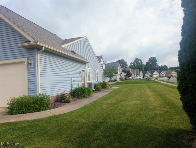 209 Potters Cir, Girard, OH 44420 - view of green lawn with a residential view and an attached garage