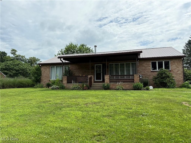 430 County Road 47, Toronto, OH 43964 - rear view of property with a porch, a yard, and brick siding