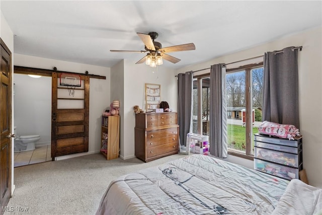 430 County Road 47, Toronto, OH 43964 - carpeted bedroom featuring a barn door, ceiling fan, and ensuite bathroom