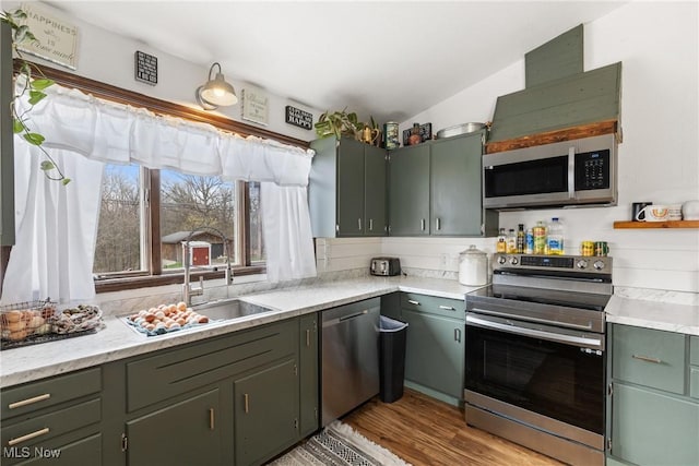 430 County Road 47, Toronto, OH 43964 - kitchen with appliances with stainless steel finishes, light countertops, and light wood finished floors