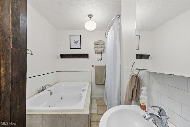 430 County Road 47, Toronto, OH 43964 - bathroom featuring a whirlpool tub, a textured ceiling, a shower with shower curtain, and tile walls