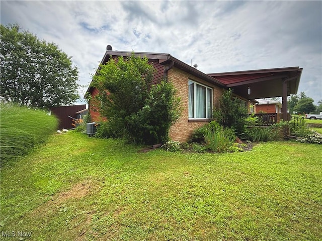 430 County Road 47, Toronto, OH 43964 - view of property exterior featuring brick siding and a yard