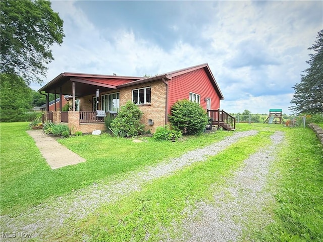430 County Road 47, Toronto, OH 43964 - view of home's exterior with driveway, a lawn, and brick siding