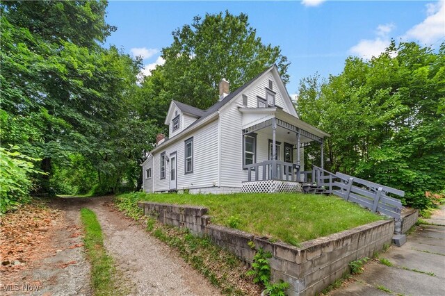 364 Campbell St, Akron, OH 44307 - view of front facade featuring a chimney and a porch