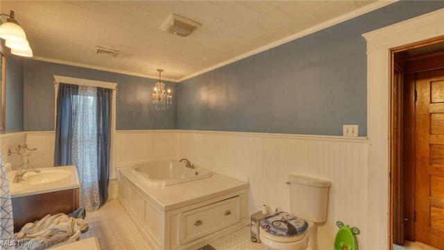 221 N 9th St, Cambridge, OH 43725 - bathroom featuring wainscoting, vanity, crown molding, and a chandelier