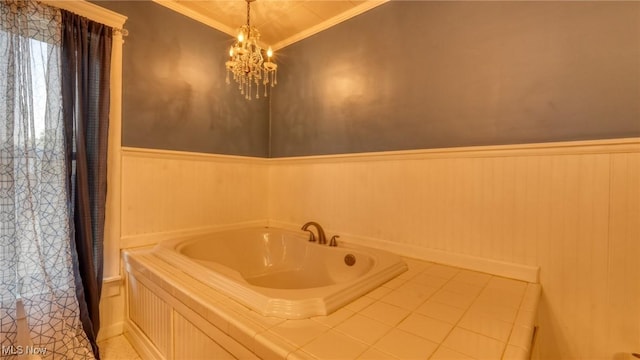 221 N 9th St, Cambridge, OH 43725 - bathroom with crown molding, a wainscoted wall, a tub to relax in, a chandelier, and tile patterned floors