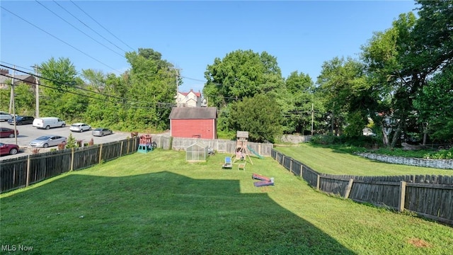 221 N 9th St, Cambridge, OH 43725 - fenced backyard featuring a playground