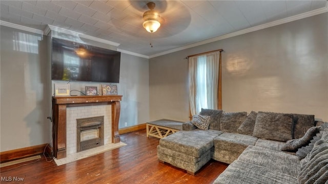 221 N 9th St, Cambridge, OH 43725 - living area featuring wood finished floors, crown molding, a brick fireplace, and a ceiling fan
