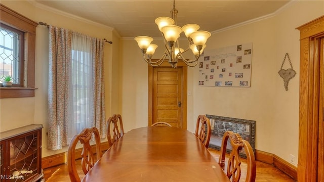 221 N 9th St, Cambridge, OH 43725 - dining area featuring a chandelier, wood finished floors, and crown molding