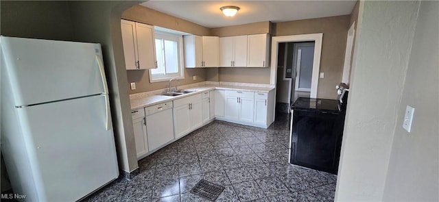 914 Dan St, Akron, OH 44310 - kitchen with white appliances, granite floors, white cabinetry, and light countertops