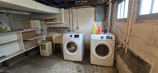 914 Dan St, Akron, OH 44310 - washroom with separate washer and dryer, electric panel, and concrete block wall